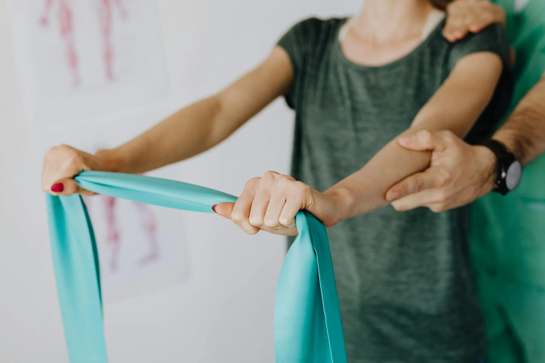 Physical therapist guiding a patient through a resistance-band exercise